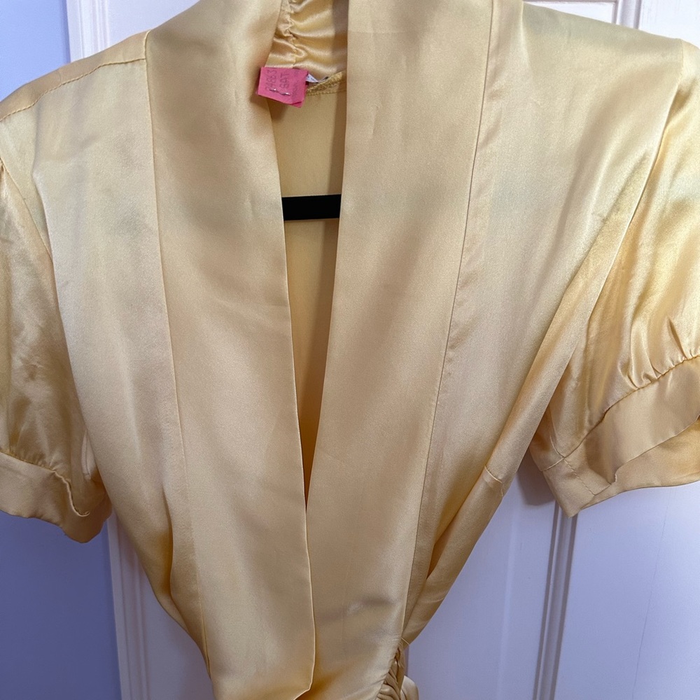 Christi Conaway yellow silk tie blouse